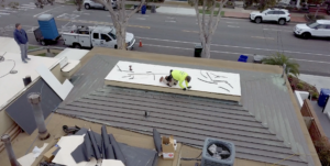 roof repair San Diego technician on residential roof