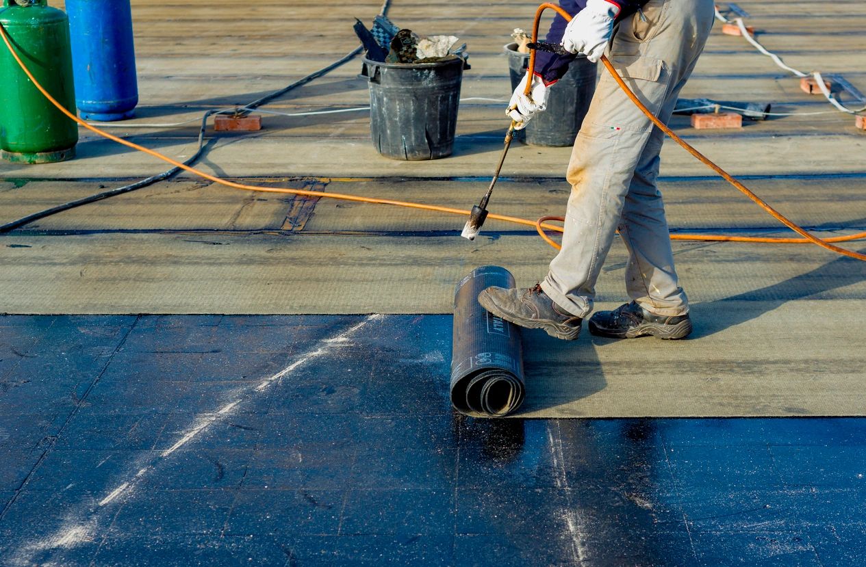 roofer performing a commercial roofing service