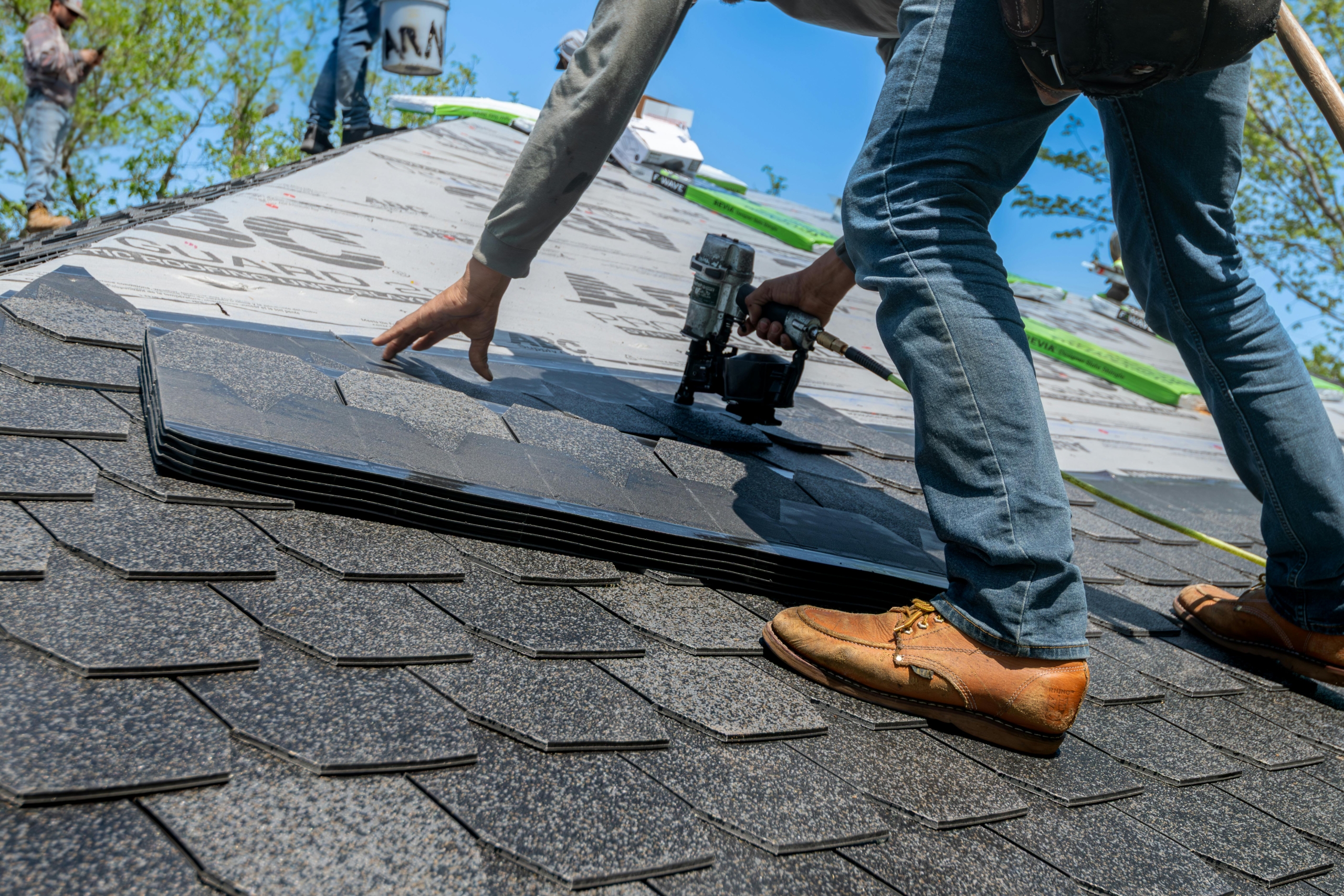 Raindance technician repairing roof flashing in La Jolla